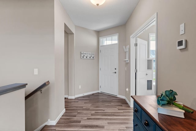 foyer entrance featuring dark hardwood / wood-style flooring