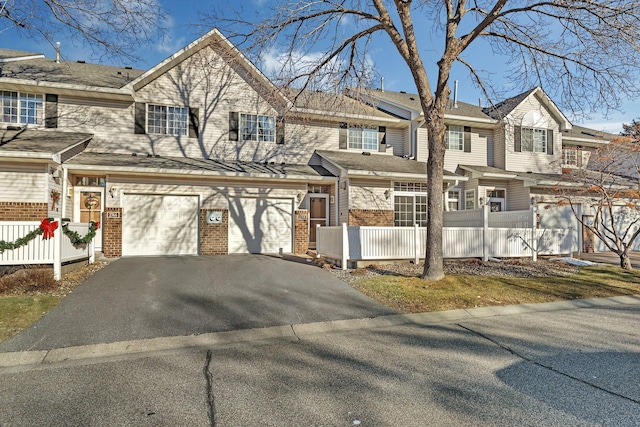 multi unit property featuring a garage