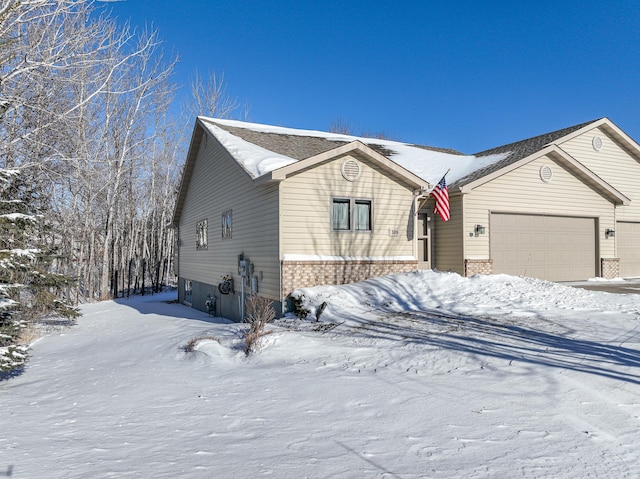 single story home with a garage