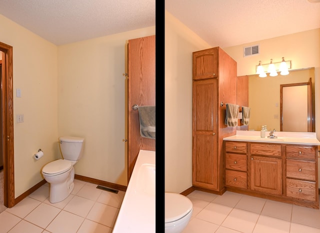 bathroom with vanity, toilet, tile patterned flooring, and a textured ceiling