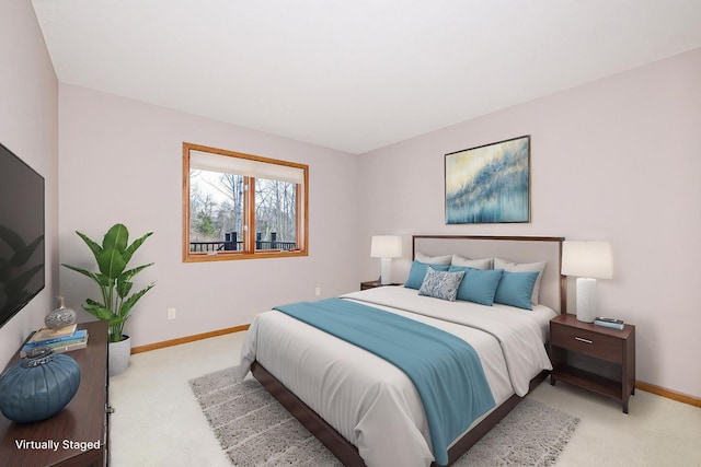 carpeted bedroom featuring baseboards