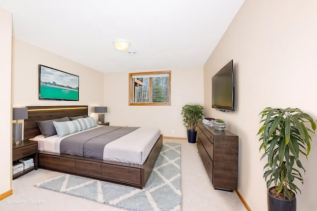 bedroom with carpet flooring and baseboards