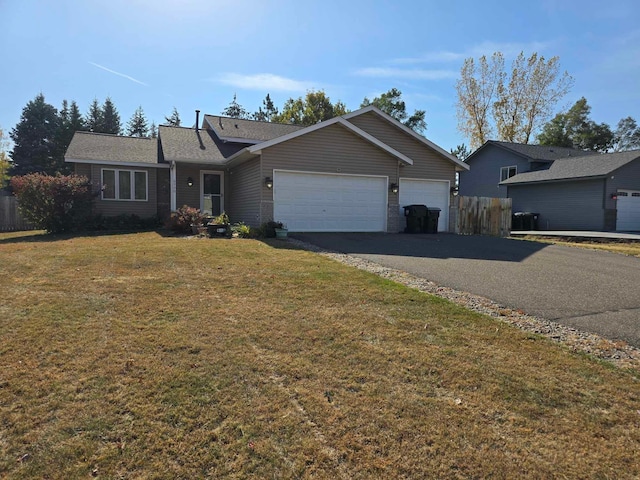 single story home with a front lawn and a garage