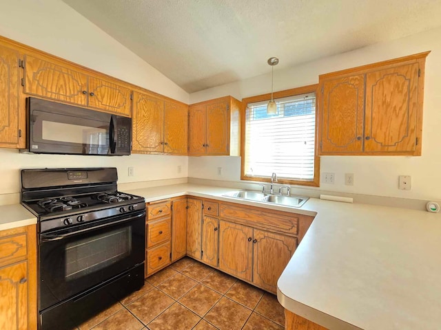 kitchen with sink, dark tile patterned floors, vaulted ceiling, decorative light fixtures, and black appliances