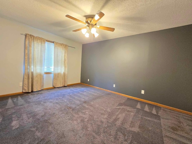 carpeted empty room with a textured ceiling and ceiling fan