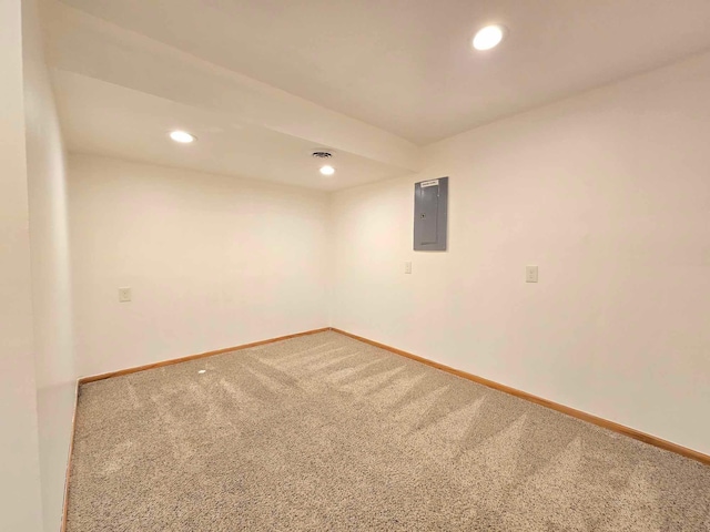 spare room with carpet flooring and electric panel