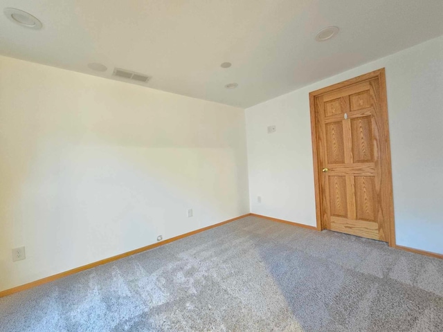 unfurnished room with carpet floors