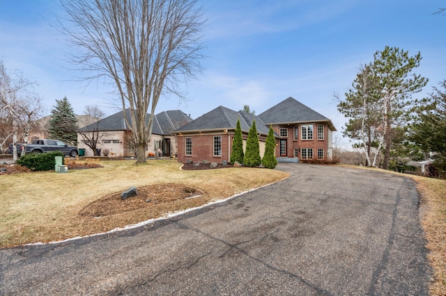 ranch-style house with a front lawn