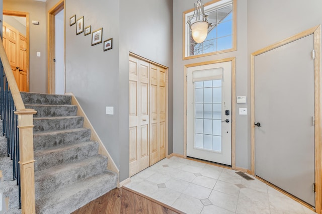 entrance foyer with plenty of natural light and a high ceiling