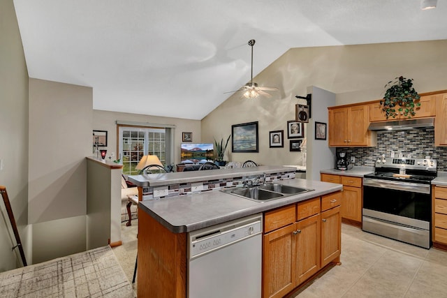 kitchen featuring vaulted ceiling, stainless steel electric stove, sink, dishwasher, and a kitchen island