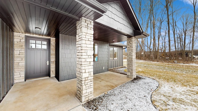 view of snow covered property entrance