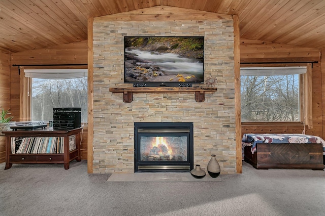 unfurnished living room with carpet, plenty of natural light, and lofted ceiling