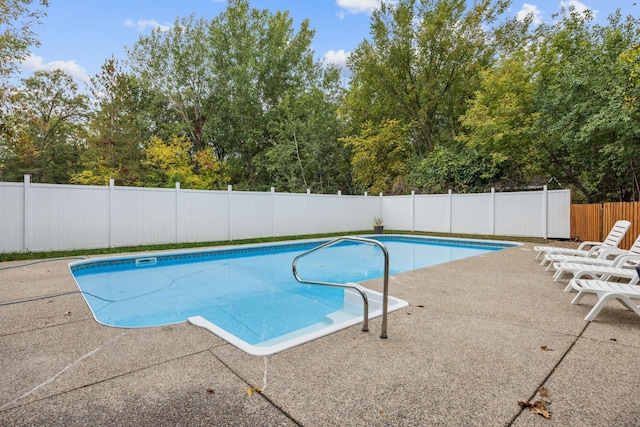 view of swimming pool featuring a patio area