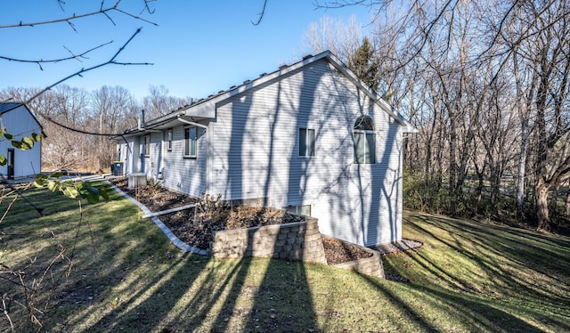 view of property exterior featuring a yard