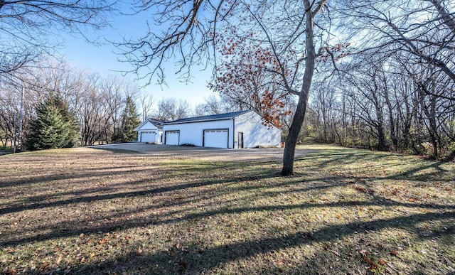 exterior space featuring a garage and an outdoor structure