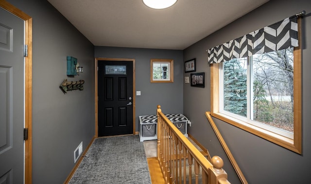 view of tiled foyer entrance