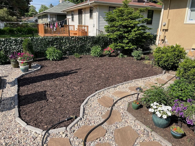 view of yard featuring a wooden deck