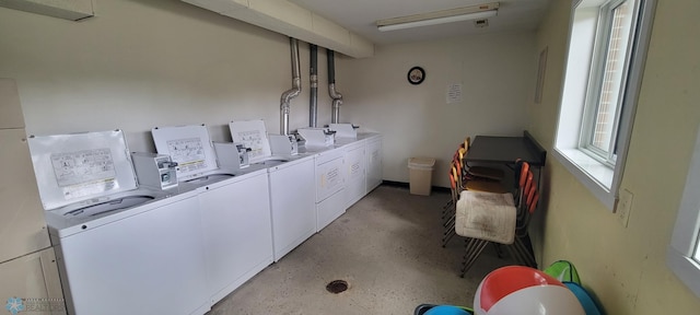 laundry room with washing machine and dryer