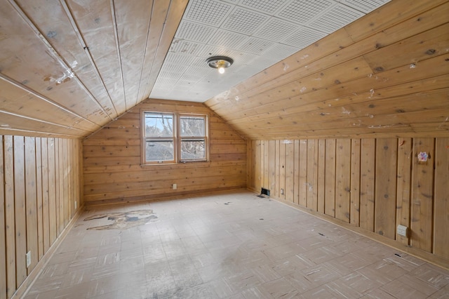 bonus room featuring wooden ceiling, wood walls, and vaulted ceiling