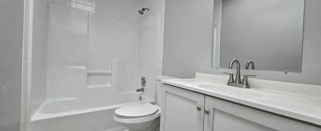 full bathroom featuring shower / bathtub combination, vanity, and toilet