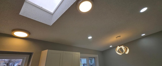 details featuring a skylight and recessed lighting