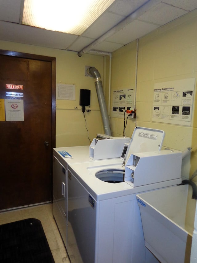 laundry room featuring sink and washer and dryer