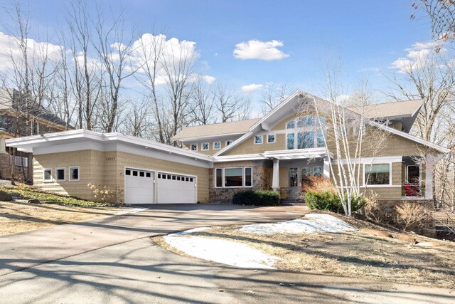 view of front of home featuring an attached garage and driveway