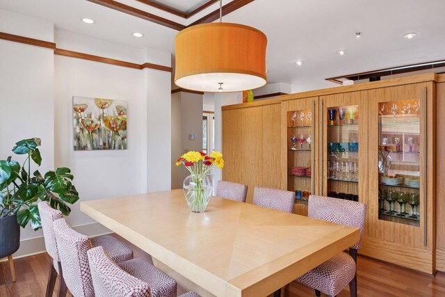 dining room with recessed lighting and wood finished floors