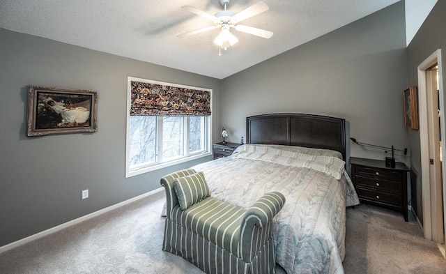 bedroom with carpet, ceiling fan, lofted ceiling, and a textured ceiling