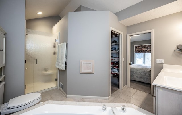 full bathroom with vanity, tile patterned flooring, plus walk in shower, and toilet