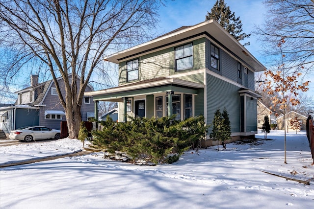 traditional style home with a garage and covered porch