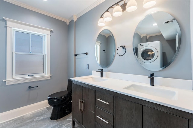 bathroom featuring washer / clothes dryer, a sink, toilet, and crown molding