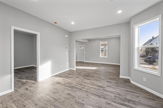 spare room with dark hardwood / wood-style floors