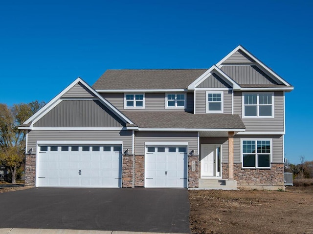 craftsman-style home with a garage