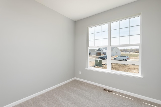 unfurnished room with carpet floors