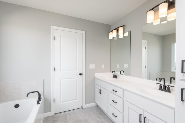 bathroom with vanity and a tub