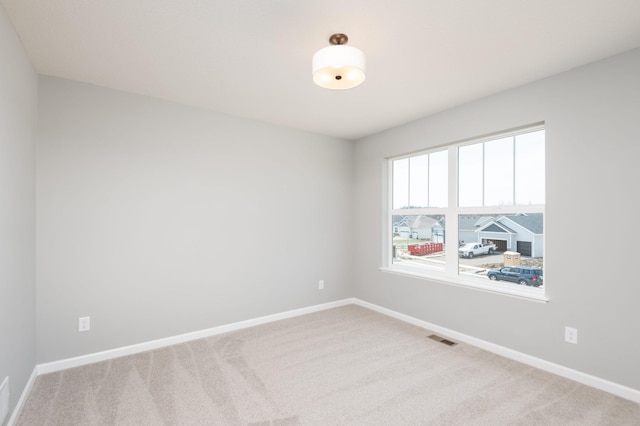 spare room featuring carpet flooring