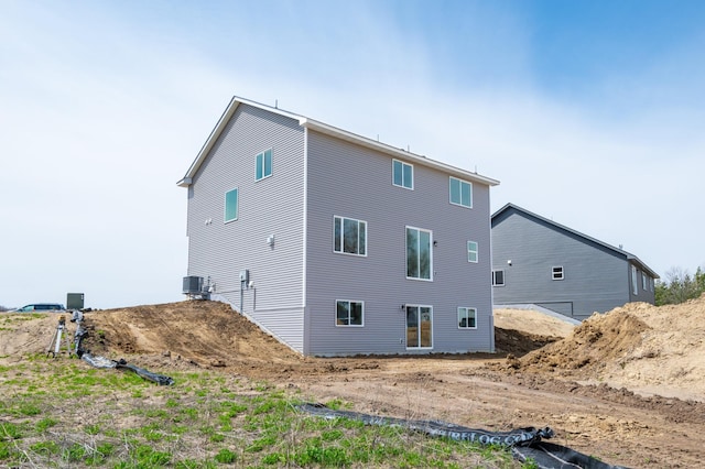 back of house with central AC