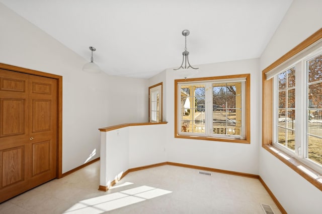 dining area featuring vaulted ceiling