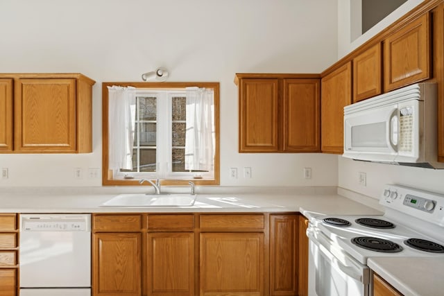 kitchen featuring sink and white appliances