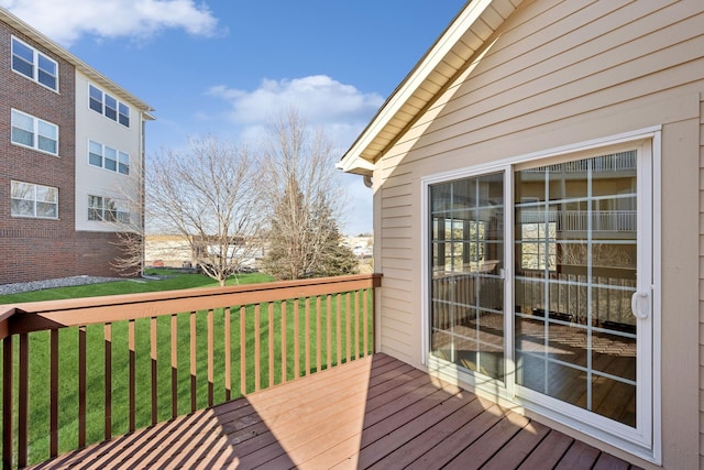 wooden deck with a yard