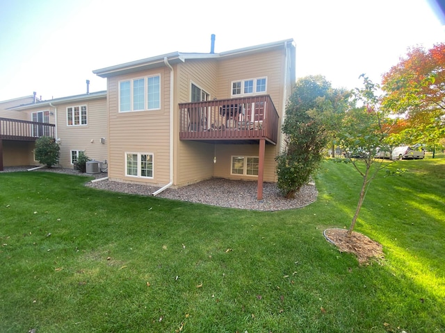 back of property with central AC unit, a yard, and a deck