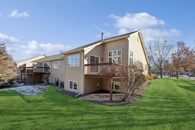 rear view of house with central AC, a yard, and a deck