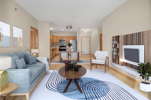 living room with light hardwood / wood-style flooring