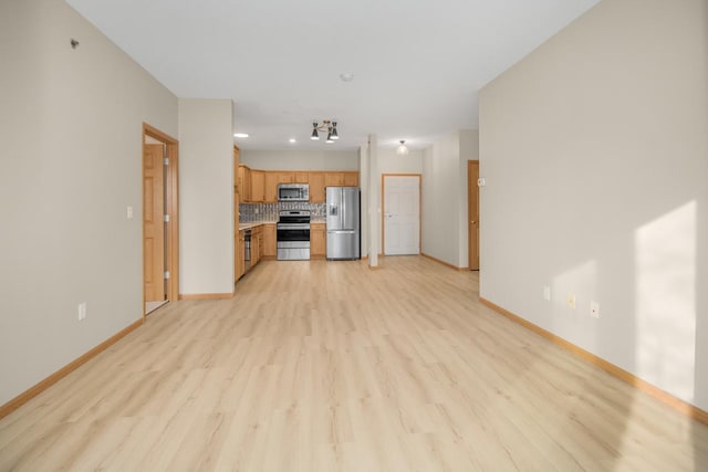 unfurnished living room featuring light hardwood / wood-style floors