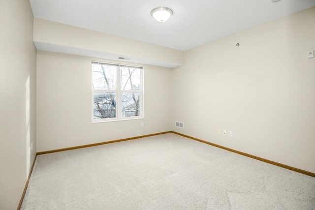 empty room featuring carpet flooring