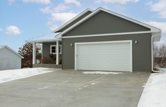 view of front facade featuring a porch and a garage