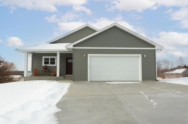 view of front of house featuring a garage and a porch