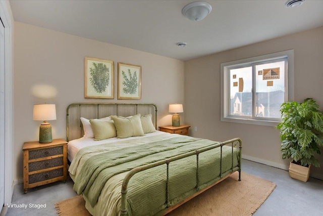 bedroom with concrete flooring