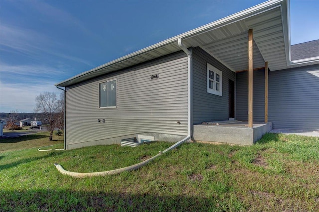 view of home's exterior featuring a yard